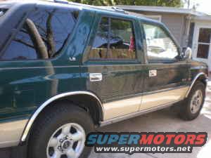 1993 Isuzu Rodeo side view, green exterior with tan lower body panels