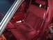 1993 Lincoln Town Car - The interior of a 1993 Lincoln Town Car features red velour seats and leather accents.