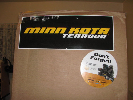 Box with Minn Kota Terrova label and a 'Don't Forget!' sticker showing connectors