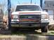 1989 Ford Bronco - Front view of a white 1989 Ford Bronco, equipped with a bull bar and parked outdoors.