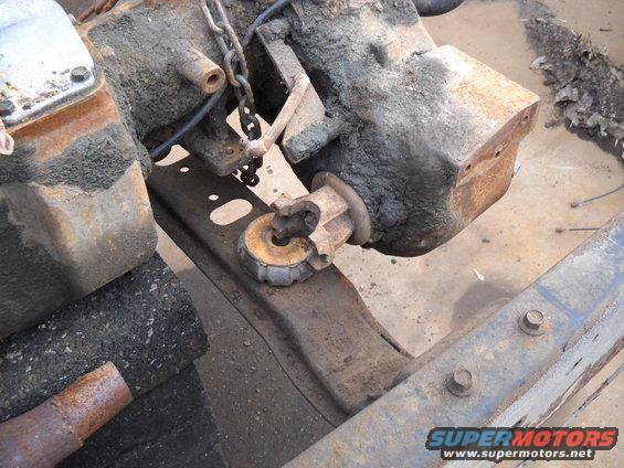 54-build--33110-009.jpg It appears the NP205 transfercase is quite a bit narrower then the BW-1345 that was in the truck. The transfercase being narrower causes a few issues.  First off the transmission mount in this truck was basically like two body mounts and a plate that bolts to the transmission. Well the front output yoke on the NP205 lands right on top of the left mount. Besides that I also have to work around the front driveshaft moving towards the center of the truck. I'll see how this works out when I get the new headers. So I'm going to have to figure out the mount and crossmember set up for this. Luckily I did keep the transmission crossmember out of the F250 that the NP435/Np205 came out of. So I'm hoping I can modify them or fabricate a new one to make something work.

I also need to work on the side support/mount that bolts to the transfer case and the frame.