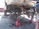 1989 Ford Bronco - Suspension work in progress on a vehicle, with the rear axle disassembled.