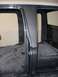 1979 Ford F-250 - The bare interior of a truck cab, with exposed floor panels and door frames, is shown in this image.