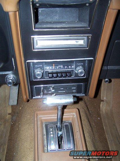 A shot of the center dash, shifter and mini console.  Love the vintage AM radio!