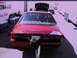 1992 Ford Mustang - This red drag car has a large spoiler and a drag chute attached to the rear bumper.