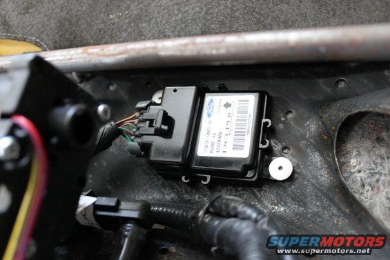 this is the problem source, the 2003 LX restraint control module. drill out the two rivets and remove the module.