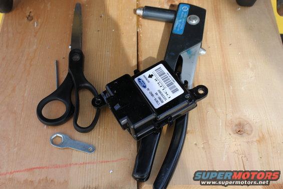 old 2003 restraint control module and some tools used. I had to drill out the rivits and re-rivit the 2007 module to the 2003 seat frame.