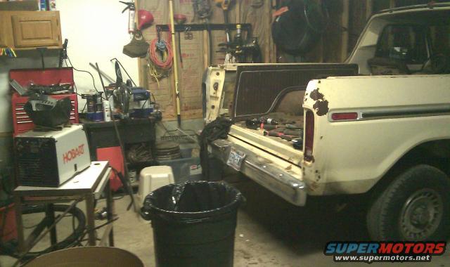 1978 Ford Bronco, white, rear view, showing rust spots and open tailgate with tools inside