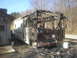 1998 GMC Sierra 3500 - This RV has been severely damaged by fire, with the front end completely destroyed.