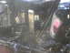 1998 GMC Sierra 3500 - The interior of a vehicle is heavily damaged by fire, with charred debris and structural collapse visible.
