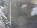1998 GMC Sierra 3500 - This RV shows extensive fire damage, with the side heavily charred and melted.