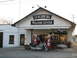 2006 Victory Kingpin - A motorcycle is parked at the Lynchburg Welcome Center, with vintage gas pumps visible.