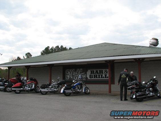 motorcycles parked in front of Half Time Bar & Grill