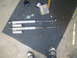 1984 Ford Bronco II - Two Bilstein shock absorbers are laid out on a mat, with a bottle and tools nearby.