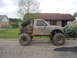 1984 Ford Bronco II - This heavily modified truck features large off-road tires and a custom roll cage, appearing to be used for off-roading.