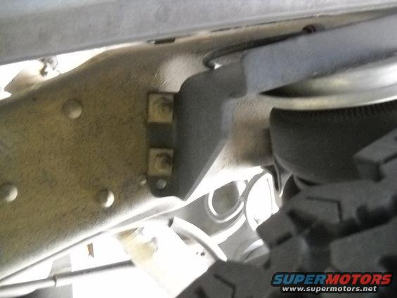 Truck frame bracket with air suspension component visible