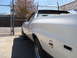 1973 Ford Ranchero - This white 1972 Ford Ranchero shows significant body damage and missing parts.