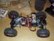 1992 Ford Ranger - A remote-controlled rock crawler chassis is shown with its battery pack, electronic components, and a remote control.