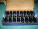 1981 Ford Mustang - A box containing sixteen blue roller rocker arms, each marked with '1.6F' and a logo.
