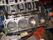 1981 Ford Mustang - Close-up view of an engine block's internal components, including pistons and cylinder bores.
