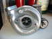 1993 Ford Taurus - A Garrett turbocharger is shown, with visible part numbers and a website logo.
