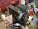 1981 Ford Mustang - Engine on stand in garage, part of a larger project.