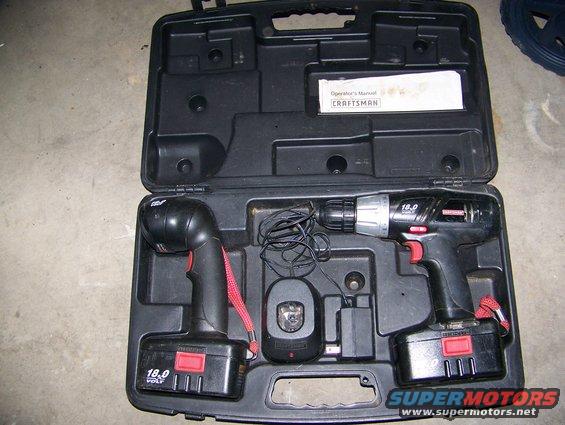 Craftsman 18.0 volt cordless drill and flashlight in a black carrying case with charger and manual