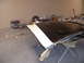 1973 Ford Ranchero - Hood undergoing paint work, a two-tone black and white stripe design.