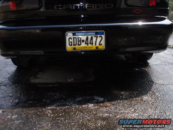 Rear of a black 2002 Chevrolet Camaro with dual exhaust and a Pennsylvania license plate