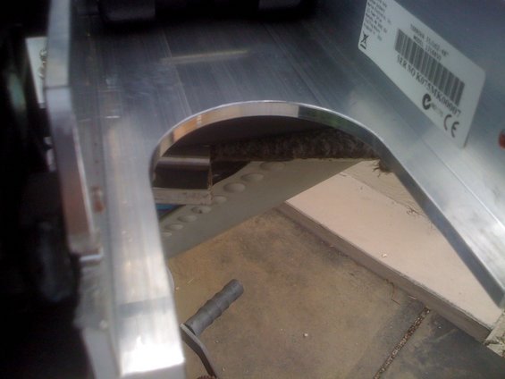 Close-up of a trolling motor part with a label showing serial number K075MK00007