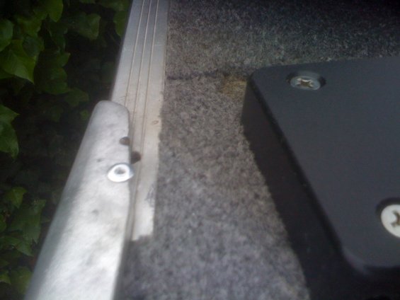 Trolling motor mount with screws on carpeted surface