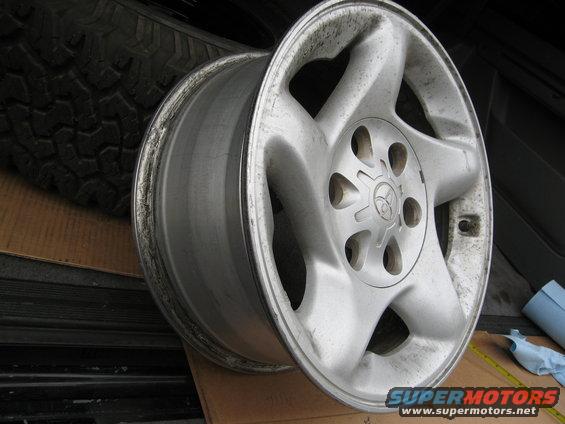 Alloy wheel with Toyota logo and five spokes