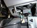 2002 Toyota Sequoia - Close-up view of exposed wiring and a light bulb socket on a vehicle's dashboard.