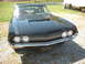 1970 Ford Falcon - Front view of a black 1970 Ford Torino with a prominent grille and dual headlights.