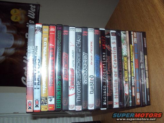 Collection of DVDs on a shelf, some with off-road themes