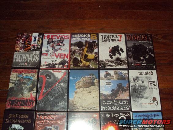 Collection of off-road vehicle DVDs on a wooden surface