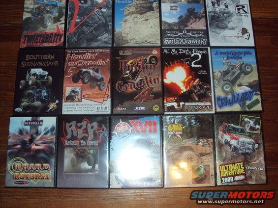 Collection of off-road vehicle video game cases, some showing trucks and buggies