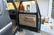 1979 Ford Bronco - View of the 1979 Ford Bronco's interior door panel and dashboard from the open driver's side door.