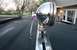 1979 Ford Bronco - Close-up of a chrome spotlight mounted on a vehicle's roof rack.
