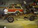 1984 Ford Bronco - A Ford Bronco body sits atop its chassis in a workshop, undergoing restoration.