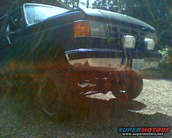 Front view of a 1987 Ford Bronco with aftermarket lights and a license plate reading 807-ZVC