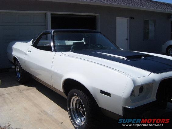 1973 Ford Ranchero, white with black hood stripes, parked in driveway