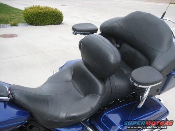 Close-up of black leather motorcycle seats and backrests with chrome accents