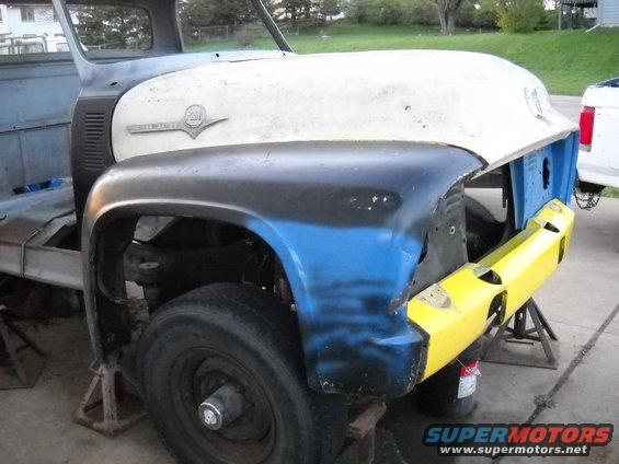 54-build--41610-074.jpg In this picture you can see how bad the damage is to the passenger front fender. There is a huge gap between the bottom of the fender and the front valance. I'm hoping I'll be able to straighten it out enough to bolt it together.