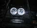 1984 Ford Bronco II - This off-road vehicle features a prominent winch and two large auxiliary headlights mounted on its front.