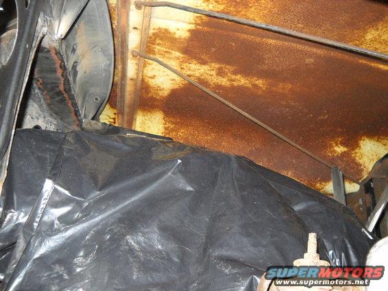 54-build--41710-040.jpg This picture shows the hood clearance I've got. :D I could run a tunnel ram and still have room to spare!! I've got over 13" of clearance above the valve covers.