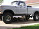 1979 Ford F-250 - This 1979 Ford F-250 pickup truck is lifted and undergoing maintenance with its front axle removed.