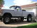 1979 Ford F-250 - This lifted pickup truck appears to be from the 1970s, possibly a Ford F-Series, undergoing some work.
