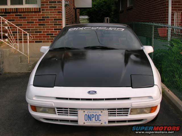 1989 Ford Probe front view, white with black hood and pop-up headlights