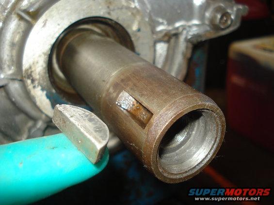 Metal shaft with a keyway and a removed key, close-up